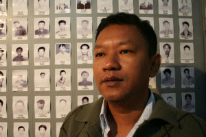 Ko Bo Gyi, in front of wall of prisoners (Photo-Phil Thornton)