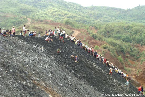 Miners Search through a Soil Pile for Jade in Hpakant