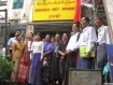 Members of Democratic Party (Myanmar) including party chairman Thu Wai (centre, in grey Burmese jacket) the middle man of the front row_ with Burmese traditional shirt) and secretary Than Than Nu (front, fourth left with purple shirt) attend the party’s signboard installation ceremony at its headquarters at No. (43), 52nd Street, Botahtaung Township in Rangoon on Friday morning. Thu Wai said its main rivals in elections to be held later this year would be the junta-backed Union Solidarity and Development Party and junta ally, the National Unity Party, the successor to the Burma Socialist Programme Party of the late former dictator Ne Win. Photo: Mizzima.