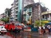 A fire official directs traffic in front of Thuria private petrol station at the corner of Anawrahta Road and Kaingtan Street in Lanmadaw Township, part of Rangoon’s Chinatown, where fire broke out at 3:10 p.m. on Wednesday, August 18, 2010. The flames failed to reach cars or the station’s petrol tanks, but two employees were taken to hospital with injuries. The blaze started at an electrical inverter, which it destroyed along with office equipment and stationery, a fire department source said.