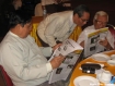 Takkatho Tin Kha (first left), Maung Wuntha (centre) and Paragu, run trained eyes over the People’s Era Journal at its launch in Rangoon on Tuesday, July 6, 2010, at the M3 restaurant near the northern archway of Shwedagon Pagoda. Despite low demand and very tight censorship by the Press Scrutiny and Registration Division, publications are still entering the market ahead of this year’s elections. Photo: Mizzima
