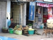 A vendor on street selling that came into force yesterday, in front of steps to flats on Baho Road in Sanchaung Township, Rangoon on Thursday, July 8, 2010. Roadside shops were mostly absent from roads across 33 Rangoon townships covered by the ban. Photo: Mizzima
