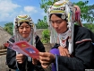 Women from Hokyin village in Kengtung, a town in the eastern part of Shan State, recently scan a pamphlet distributed by the National Democratic Force party, which split from the National League for Democracy party. The village is situated at about 3,500 feet (1,067 metres) above sea level and its residents lacked information about the election to be held on Sunday. Photo: Mizzima
