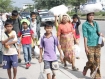Burmese returnee refugees walk towards the Thai-Burmese Friendship Bridge towards Myawaddy from Mae Sot, Thailand on Tuesday, November 9, 2010, where they were being provided with temporary shelter and food. Up to 20,000 people fled across the Moei River when heavy fighting broke out a day earlier between a Democratic Karen Buddhist Army splinter group and the Burmese Army, which resulted in casualties on both sides of the border. Reports from Myawaddy town say the splinter group has withdrawn from the town. Fighting is however continuing at Three Pagodas Pass, seized late on Monday night by the rebel DKBA faction. Photo: Mizzima.