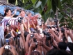 At her first public appearance upon release from house arrest, Aung San Suu Kyi greets thousands of cheering, chanting, happy supporters in front of her home on University Avenue in Rangoon, this evening, November 13, 2010. She told the jubilant crowd that she would meet them at the National League for Democracy headquarters at noon tomorrow (November 14, 2010). Photo: Mizzima.