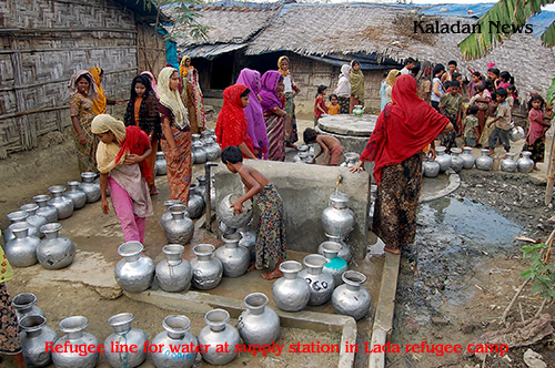 Refugee line up for water at supply station in Lada refugee camp camp-03a