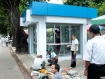 Retail booths called ‘Media Corners’ (in background) are being built by the Myanmar Writers and Journalists Association in six townships in Rangoon. The media corners will sell newspapers, magazines, books, phone cards and computer accessories. Photo: Mizzima 