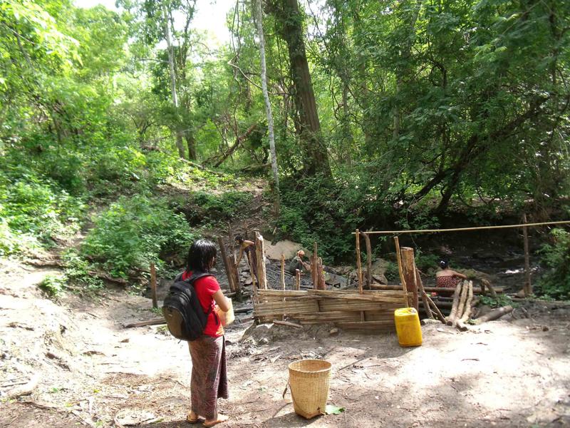 Maw Kayah and villagers go to bring water