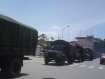 A line of Burmese military trucks believed to be carrying weapons and ammunition is seen before entering Burma from China at the border gate of Jiegao in Yunnan Province on Tuesday, July 12, 2011. Observers said that about 300 military trucks have passed through the area in the past three days. Photo: Mizzima 