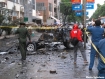 Military officers investigate after a bomb explosion destroyed a parked car in front of the Zaygyo Hotel in Mandalay on Friday, June 24, 2011. At least one person was injured in the blast. Photo: Sytmhone