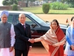 Indian Prime Minister Manmohan Singh, left, stands as Burmese President Thein Sein shakes hands with Indian President Prathibha Patil flanked by Burma's first lady Khin Khin Win during a full state welcome at the Presidential Palace in New Delhi on Friday, October 14, 2011. India rolled out the red carpet, sensing a chance to deepen relations with a neighbour traditionally allied to New Delhi's regional rival Beijing. Photo: AFP