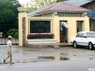 A child walks past the notorious Insein Prison in Rangoon on Thursday, May 5. Rumours are circulating that a general amnesty would be granted to prisoners, including political prisoners. Journalists waited at the prison, but no prisoners were released. Extra police guards were posted around the prison. Photo: Mizzima