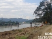 The Kachin Development Network Group said surveyors were seen working in the Myitsone Dam project area on Thursday, October 11, 2011. The workers, on the right, appeared to be conducting land surveys between Lahpye and Tawngban villages. This photo was taken looking upstream. The Irrawaddy-Myitsone bridge and a containment wall can be seen in the distance. Construction Site No.7 is directly across the road to the right. Photo: KDNG