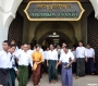 Surrounded by her NLD security escort, Aung San Suu Kyi leaves the Ananda Phaya temple in Bagan on the second day of her four-day tour of the ancient temple complex. Photo: Mizzima