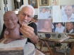 American sculptor Jim McNalis with his bust of Zarganar, the Burmese comedian who has been imprisoned for his humanitarian work during Cyclone Nargis. Photo: Mizzima