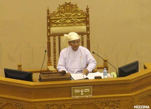 Burmese President Thein Sein, here shown in traditional dress in Parliament, has invited exiles to return home. A bill to enact the offer will be introduced in Parliament. Photo: Mizzima Thein-Sein-parliament-session-august-22-2011