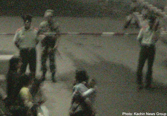 An armed Chinese soldier with two policemen stood on Friday night at the main Laiza border gate and people were banned from crossing into the Chinese territories. laiza_china_gate