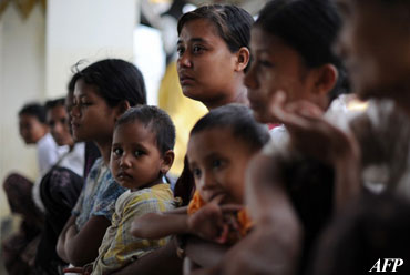 This file photo taken on June 14, 2012 shows Rakhine families at a monastery used as a temporary shelter for people displaced by days of violence in Sittwe, the capital of Rakhine State. Photo: AFP