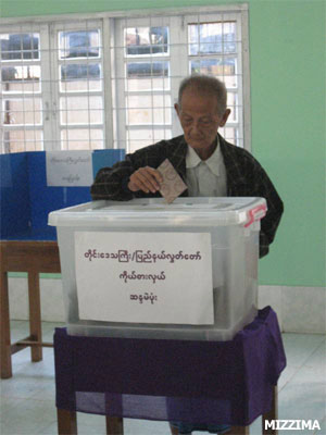 A senior citizen inserts his vote into a ballot box at a polling booth in Dagon Township, Rangoon, in Burma's first election in 20 years in 2010. Photo: Mizzima