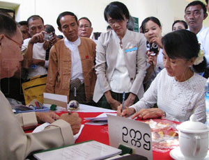 Aung San Suu Kyi registers to run as a candidate for Parliament in the upcoming by-elections at the Thanlyin Township election commission office on the outskirts of Rangoon on Wednesday, January 18, 2012. Hundreds of supporters cheered her. Photo: Mizzima