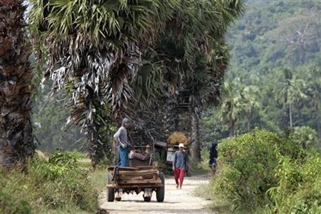 Farm workers drive down a road in a village in southern Myanmar near Dawei and the site of a planned special economic zone and deep sea port November 19, 2011. Photo: Reuters/Staff/Files Farm workers drive down a road in a village in southern Myanmar near Dawei and the site of a planned special economic zone and deep sea port November 19, 2011. Credit: Reuters/Staff/Files