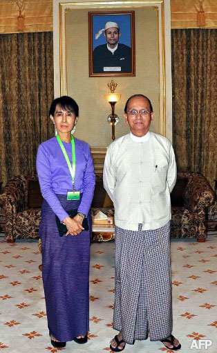 Aung San Suu Kyi 
and President Thein Sein after a meeting in Naypyitaw. In the background
 is a picture of Suu Kyi's father, Aung San, who is widely admired as 
the father of the country. Photo: AFP