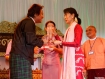 Aung Sun Suu Kyi presents film director Wyne an award for 'Ban that Scene,' a favorite of the Arts of Freedom Film Festival, on Wednesday, January 4, 2012. Photo: Mizzima 