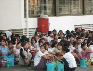 About 2,000 workers from three factories in the Hlaing Tharyar Industrial Zone continued their strike today, demanding better wages urgent8s