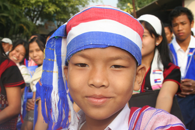 Nine year old Saw Zin Min proudly wore the colors of  the Karen flag during recent Karen New Year celebrations in Mae Sot.