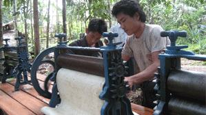A rubber cultivator flattens out the collected rubber into rubber sheets