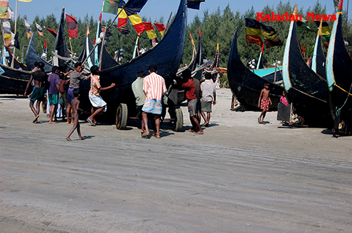 Fishermen pushing a boat to the sea for fishing fisherman