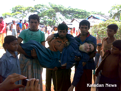 Refugee carrying Abdul Hamid, 53, elderly refugee to the clinic after local attacked Ktu-01