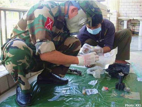 KIA officer checks a seized weapon in Laiza chemical-weapon