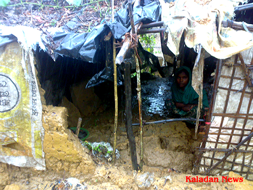 A refugee woman sitting inside damage shack in unregistered refugee camp ktu-rain-01