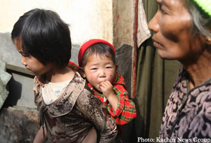 A nine year old Kachin girl and her three year old sister wait in the KIO-controlled border town of Mai Ja Yang for the conflict to end so they can go home. According to the girl, her sister developed a bad rash shortly after they fled their village last October. A nine year old Kachin girl and her three year old sister wait in the KIO-controlled border town of Mai Ja Yang for the conflict to end so they can go home. According to the girl, her sister developed a bad rash shortly after they fled their village last October.
