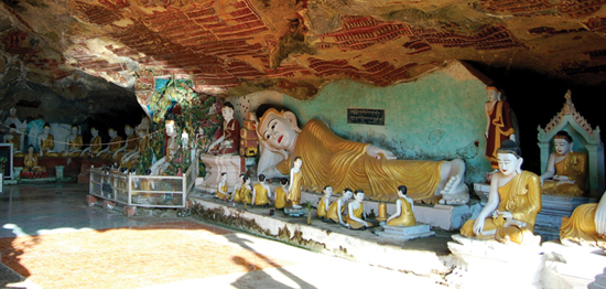 Reclining Buddha figure outside entrance to Kaw Goon Cave