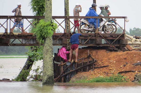 A bridge that has been affected by flooding. A bridge that has been affected by flooding.