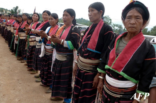 This photo taken on May 24, 2013 shows local ethnic Palaung women attending a religious ceremony by the ethnic Shan militia group in Mangpan in Myanmar's northeastern Shan State. Ethnic Wa make up about one percent of the Myanmar population, with about 800,000 people of various ethnic groups in the self-administered region, according to the United Wa State Army spokeman. AFP PHOTO This photo taken on May 24, 2013 shows local ethnic Palaung women attending a religious ceremony by the ethnic Shan militia group in Mangpan in Myanmar's northeastern Shan State. Ethnic Wa make up about one percent of the Myanmar population, with about 800,000 people of various ethnic groups in the self-administered region, according to the United Wa State Army spokeman. AFP PHOTO