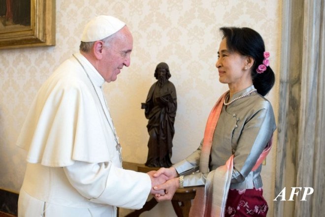 A handout photo taken on October 28, 2013 and provided by the Osservatore Romano shows Nobel Peace Laureate and Myanmar opposition leader Aung San Suu Kyi (R) being welcomed by Pope Francis during a private audience at the Vatican. Pope Francis called for inter-religious dialogue in Myanmar on October 28 at an audience for Nobel Prize winner Aung San Suu Kyi in which the two also discussed her long campaign for democracy. AFP PHOTO A handout photo taken on October 28, 2013 and provided by the Osservatore Romano shows Nobel Peace Laureate and Myanmar opposition leader Aung San Suu Kyi (R) being welcomed by Pope Francis during a private audience at the Vatican. Pope Francis called for inter-religious dialogue in Myanmar on October 28 at an audience for Nobel Prize winner Aung San Suu Kyi in which the two also discussed her long campaign for democracy. AFP PHOTO