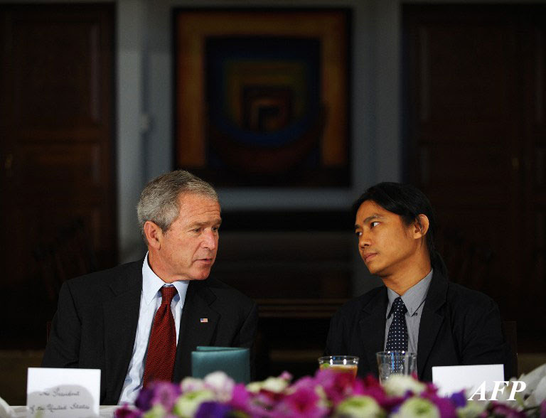 Former US President George W Bush chats with U Aung Zaw