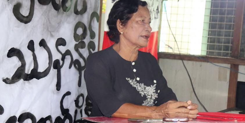 Photo caption - Daw Nyo Aye seen at the Rice Crisis anniversary event