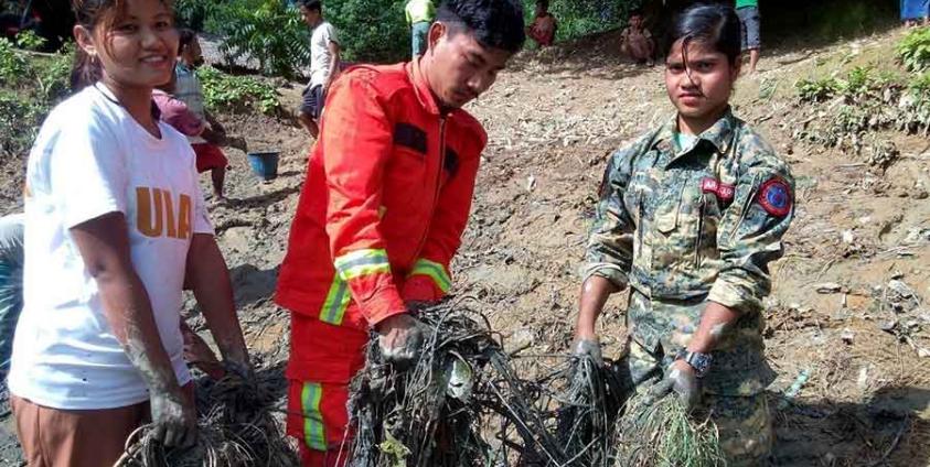 APM (Arakanese, Hindu and Muslim residents alongside ULA/AA members clean a flood-damaged drinking water pond in Gaungni Village, Buthidaung Township, on August 15, 2026.)