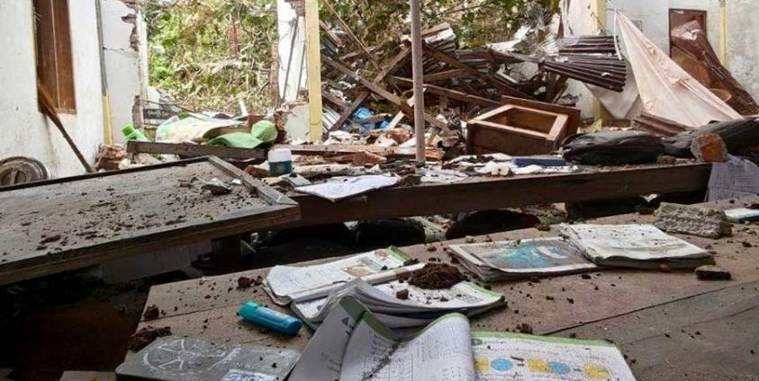 Photo: AA Info Desk / A school building destroyed by an airstrike on Seinnyinwa Village, Paletwa Township, on August 24.