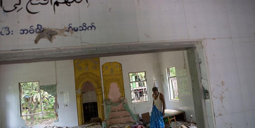 Ibrahim, 67, looks around inside the destroyed mosque at Thuye Tha Mein village of Waw township in Bago Province, Myanmar, 24 June 2016. Photo: Lynn Bo Bo/EPA