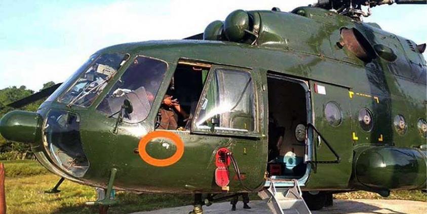 A military helicopter flying to rescue detained Tatmadaw troops and civilians from the Shwe Nadi ferry was shot by Arakan Army soldiers on 26 October 2019. (Photo: Tatmadaw)