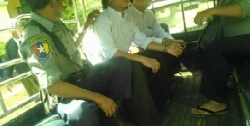 U Than Htike Thu and U Sun Moe Tun in a Police Van