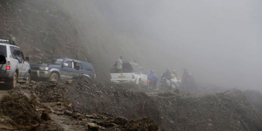 A picture made available on 21 October 2016 shows cars drive on a narrow hill-side road near Tedim city, Chin State, Myanmar, 12 October 2016. Photo: Nyein Chan Naing/EPA