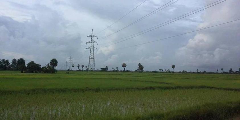 Electricity towers and lines seen across local paddy fields (Photo: Naiaung Naing)
