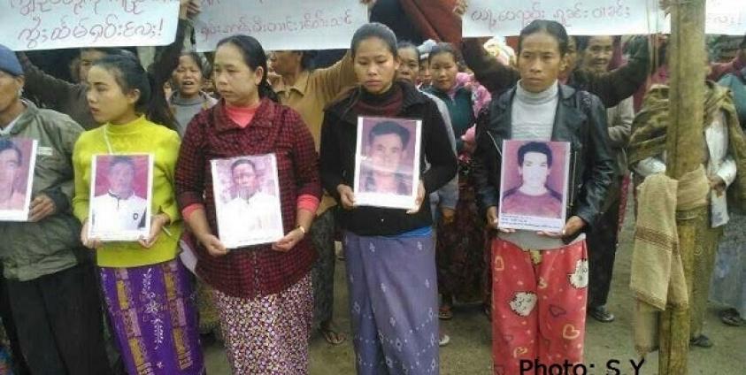 Protesters hold pictures of their abducted relatives during a protest in Mongwi village in Namkham Township. (Photo: S.Y.)