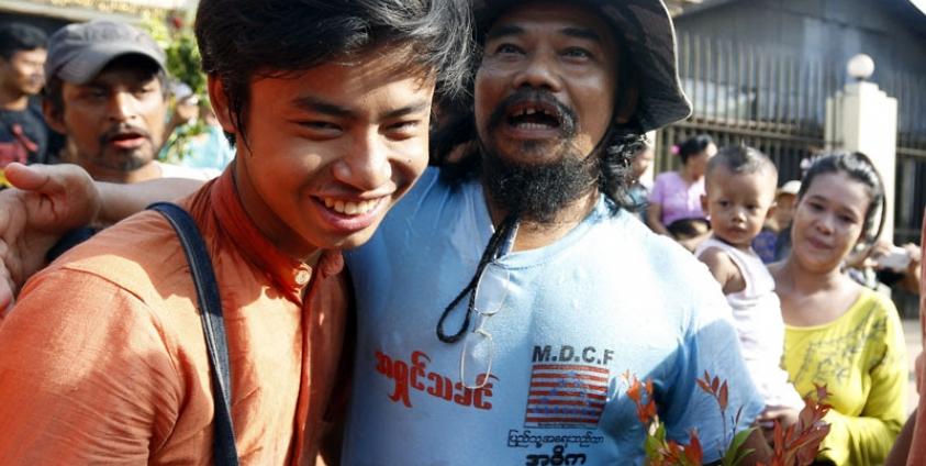 Htin Kyaw (R), director of the Movement for Democracy Current Force (MDCF), a community-based organisation working to promote development and democracy in Myanmar, is reunited with his friends after his release from Insein prison in Yangon, Myanmar, 17 April 2016. Photo: Nyein Chan Naing/EPA